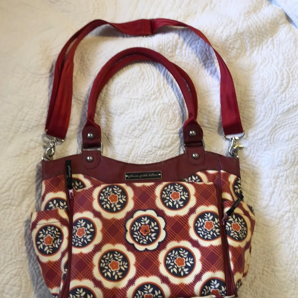 Petunia Pickle Bottom Red and Brown Kids Diaper Bag with Fold-Out Changing Pad